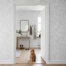 Lägenhetshall med Slinger-tapet och katt