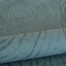 Origin tapet tvärsnitt trädstammar - smaragdgrönt - Hemmavid.se